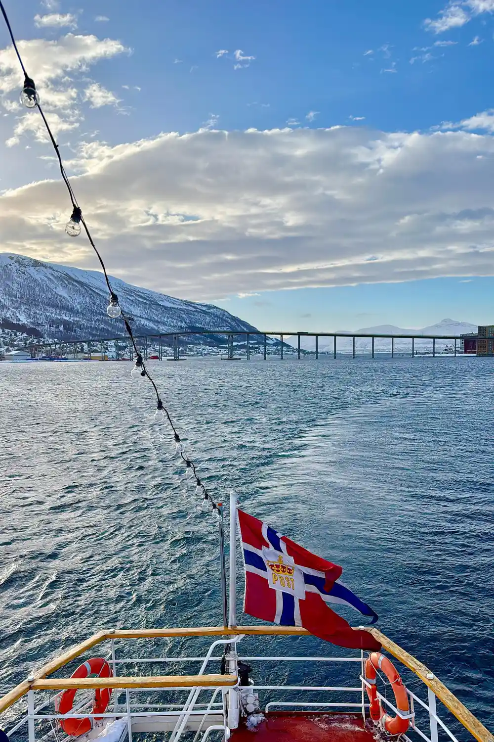 The Tromso bridge and snowy peaks seen from the deck